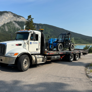Cooper Equipment Rentals delivery truck with equipment in the back.